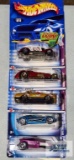 Three 2002 Trump Cars series and two Spectraflame 2 Hot Wheels cars, new in packages