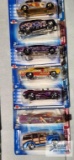Three Classic 2004 Hot Wheels cars, three Wastelanders 2003 Hot Wheels cars, and one Dragon Wagons