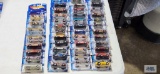 Eight 2003 Hot Wheels cars new in packages and Thirty-five 2003 First Editions Hot Wheels cars, new