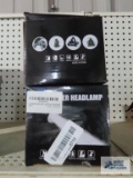 Pair of power headlamps in boxes