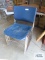 Five metal and plastic stacking chairs