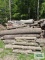 Pile of assorted wood. Pieces are approximately 10' to 12' long. Bring qualified help and equipment