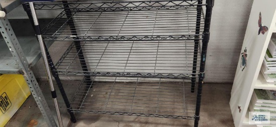 Black metal adjustable shelving unit