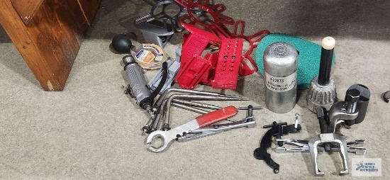 Variety of specialty automotive tools including pullers, pneumatic tie grinder, air conditioning