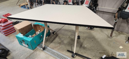 Roll about writing table with formica top. Overall length is 5', width is 26" and height is 29".