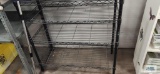 Black metal adjustable shelving unit