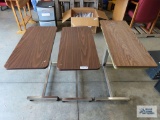 Three roll about adjustable height over bed tables