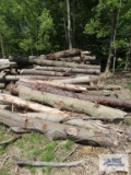 Pile of assorted wood. Pieces are approximately 10' to 12' long. Bring qualified help and equipment