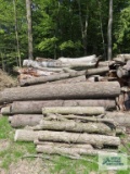 Pile of assorted wood. Pieces are approximately 10' to 12' long. Bring qualified help and equipment