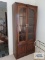Fruitwood china cabinet with bottom storage. On first floor.