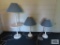 Tray table floor lamp with two matching table lamps.