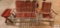 Redwood and aluminum outdoor settee and rocker and end table. In basement.
