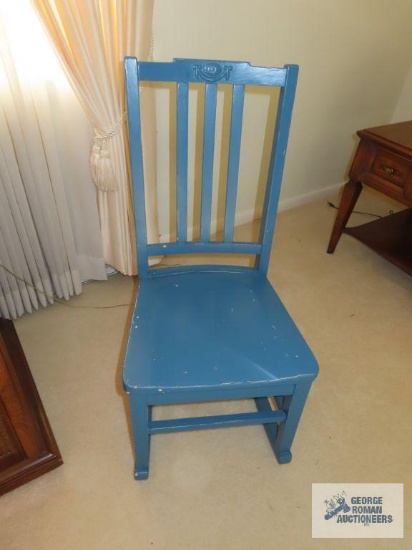 Antique blue painted rocker. On first floor.