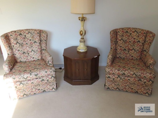 Pair of decorative wingback armchairs. On first floor.