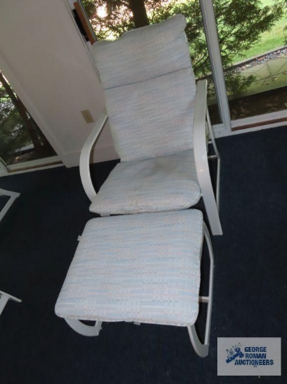Outdoor armchair with footstool. On first floor.