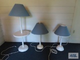 Tray table floor lamp with two matching table lamps.