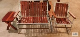 Redwood and aluminum outdoor settee and rocker and end table. In basement.