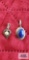Silver colored pendant with blue stone, marked JH and Sterling and silver colored pendant with pearl