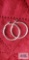 Silver colored hoop earrings, marked 925.
