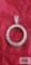 Silver colored circle pendant, marked 925.
