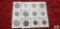 Italian coins in coin holders.