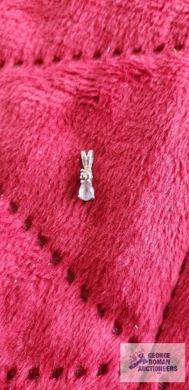 Silver colored pendant with gray and clear gemstone, marked 14K.