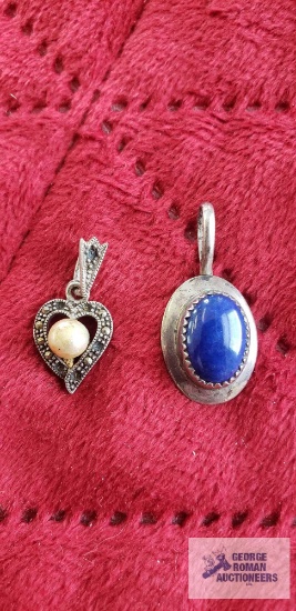 Silver colored pendant with blue stone, marked JH and Sterling and silver colored pendant with pearl
