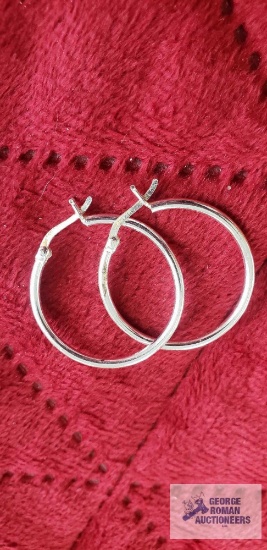 Silver colored hoop earrings, marked 925.