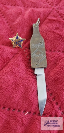Coca-Cola pocket knife and Chevy All Star pin.