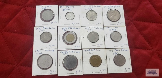 Italian coins in coin holders.