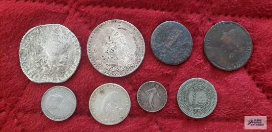 Variety of foreign coins/tokens.