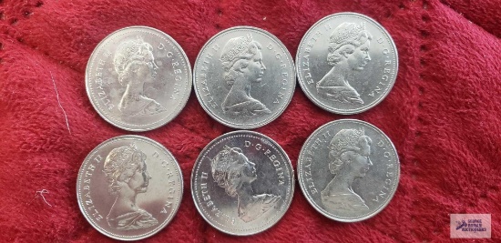 Six Canadian one dollar coins