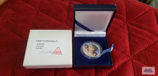 1965 Colorized Kennedy half dollar coin.