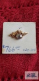 Gold colored sword tie tack with clear gemstone, marked 14K.