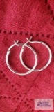 Silver colored hoop earrings, marked 925.
