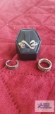 Three silver colored rings, one marked 925