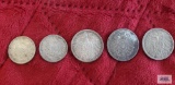 1874, 1896, and 1950 German one mark coins and 1913 and 1916 German half mark coins.
