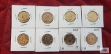Gold colored state quarters.