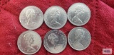Six Canadian one dollar coins