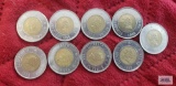 Nine Canadian two dollar loonie coins