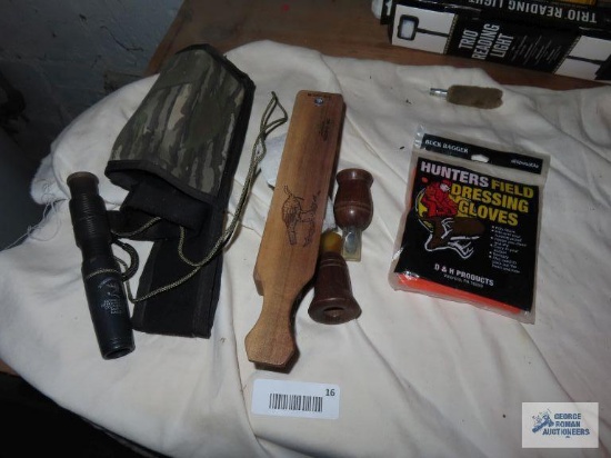 Turkey call, duck calls, and field dressing gloves
