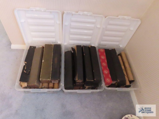 Antique piano rolls with small totes and lids