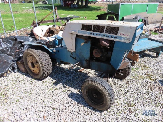 Vintage Sears Suburban tractor with mower deck. Front axle bolt is sheared off of the left wheel. We