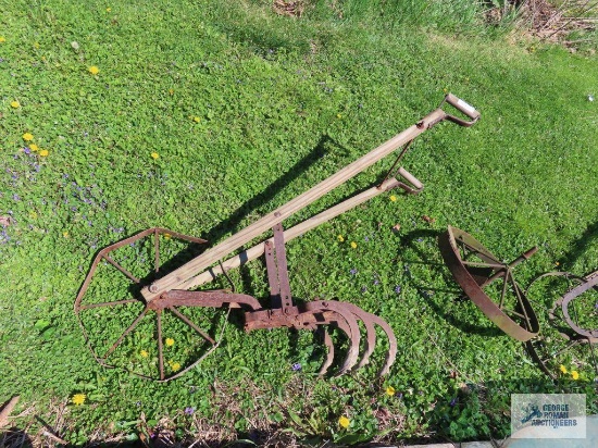 Two antique cultivators with antique wheel