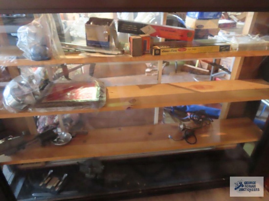 Variety of New Old Stock and used auto parts in display case