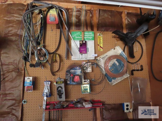 Hardware, trailer wiring, copper tubing kit on pegboard