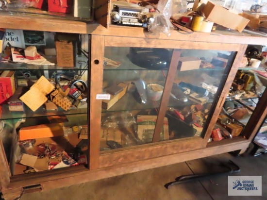 New Old Stock and used automotive parts in display cabinet