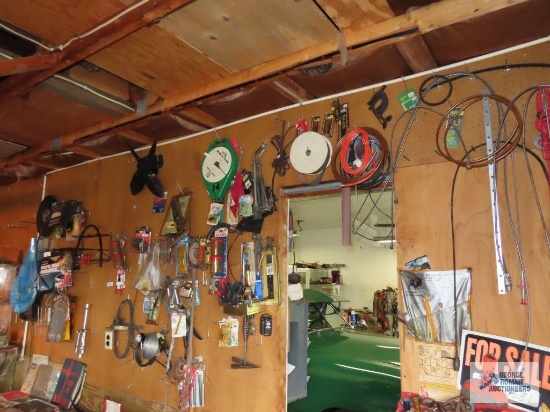 Large amount of hardware and tools on pegboard