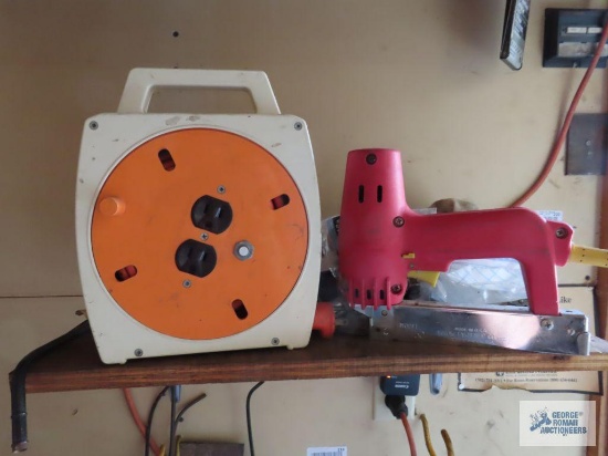 Reel style extension cord and electric stapler
