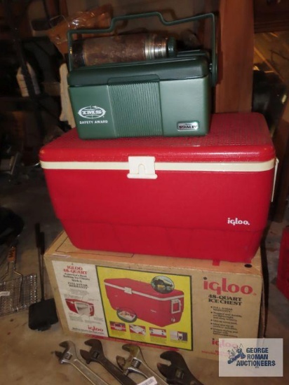 Igloo cooler and Stanley cooler and other thermos. Top is missing from thermos